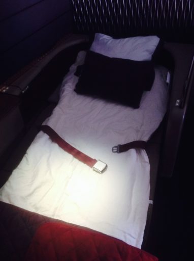 qatar airways, first class, bed