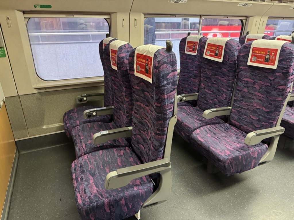 De stoelen in de 2e klasse in de G7268 Trein van Nanjing naar Shanghai.