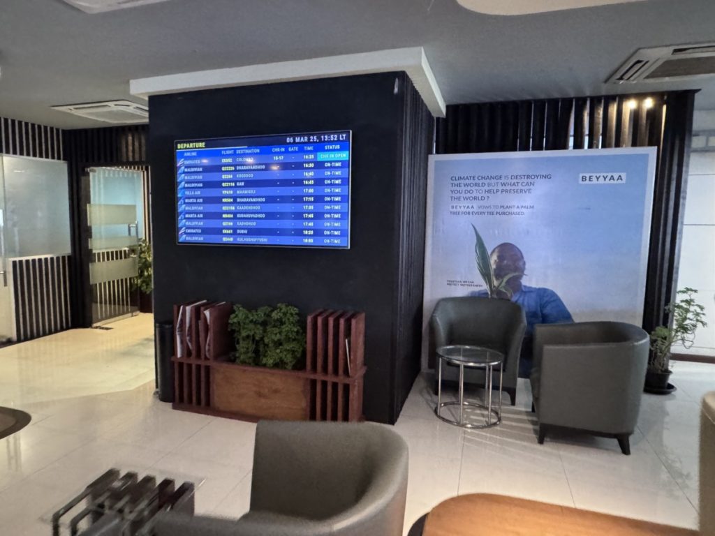 Information screens in the Moonimaa Lounge at MLE Airport.